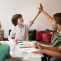 Children playing safely in a licensed daycare classroom.